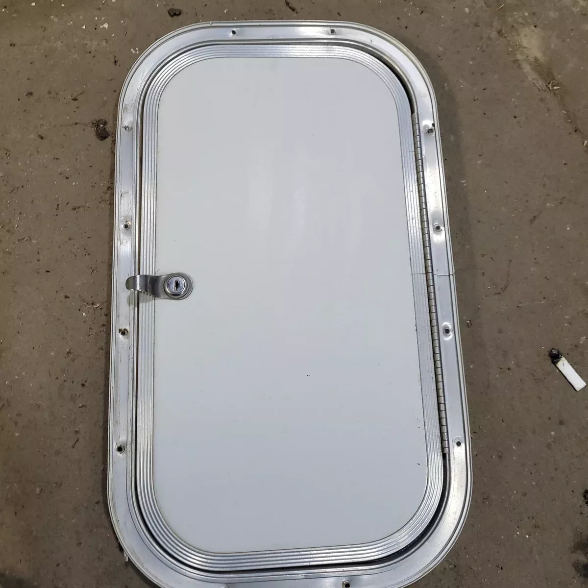 Used Radius Cargo / compartment Door 19 3/4″ X 10 3/4″ X 1/2″D