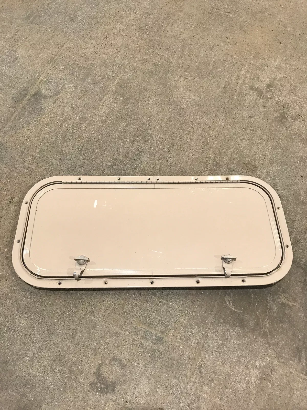 Used Radius Cargo / compartment Door 23 3/4″ W x 9 3/4″ H