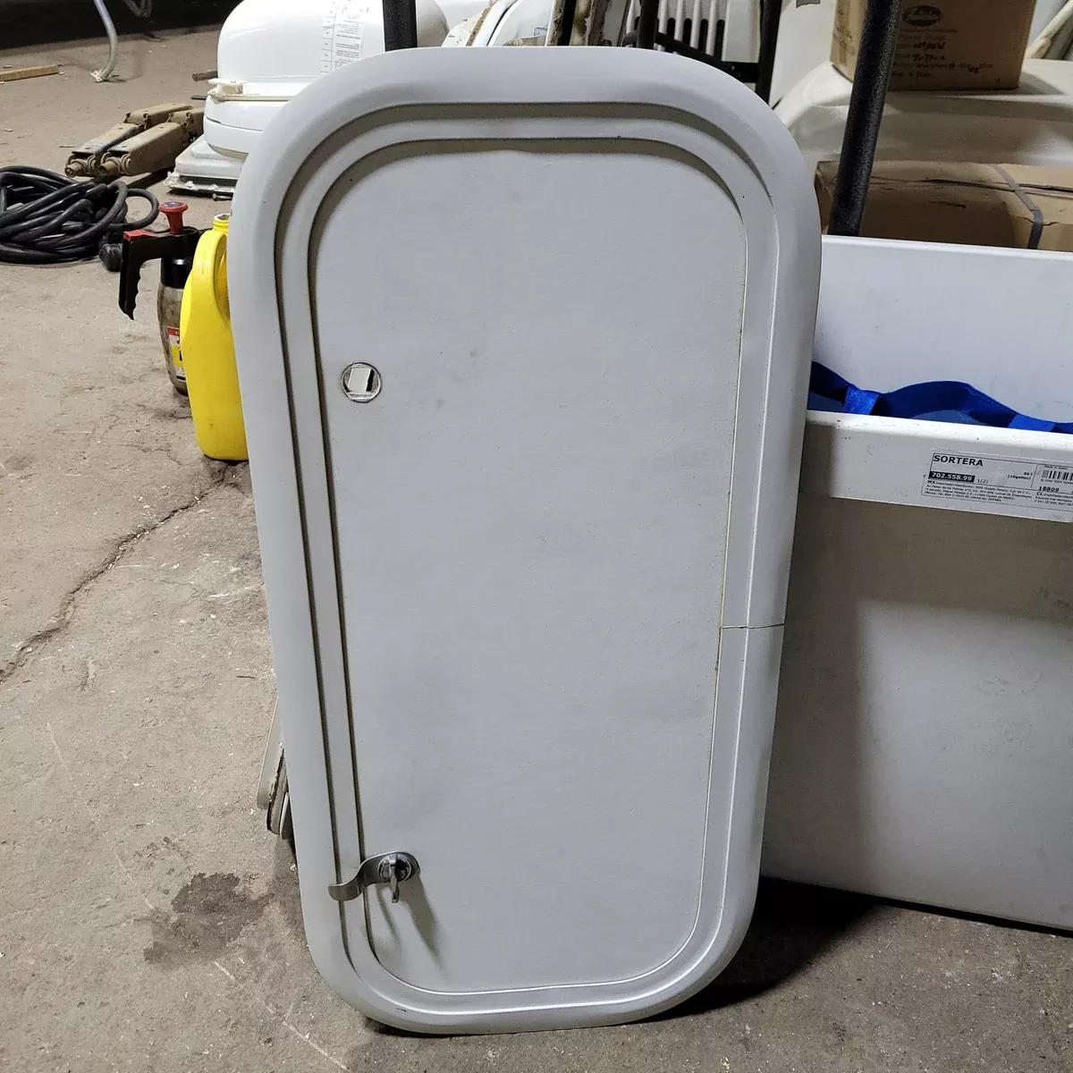 Used Radius Cargo / compartment Door 23 3/4″ X 10 1/2″ X 1″D