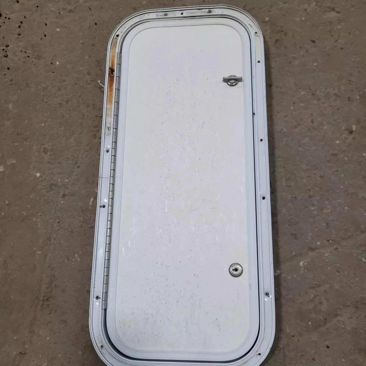 Used Radius Cargo / compartment Door 23 3/4″ X 9 7/8″ X 1/2″D
