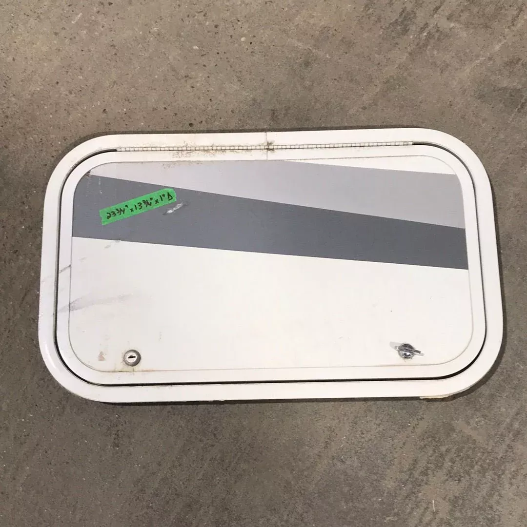 Used White Corner radius cargo door23 3/4″ W x 13 3/4″ H x 1″D